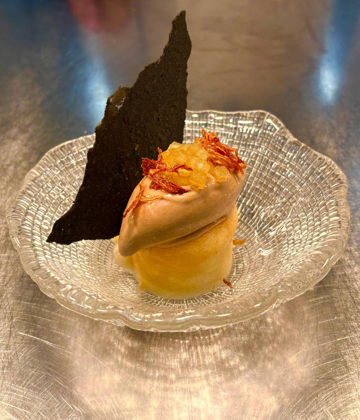 Dessert in a glass with a caramel tuile