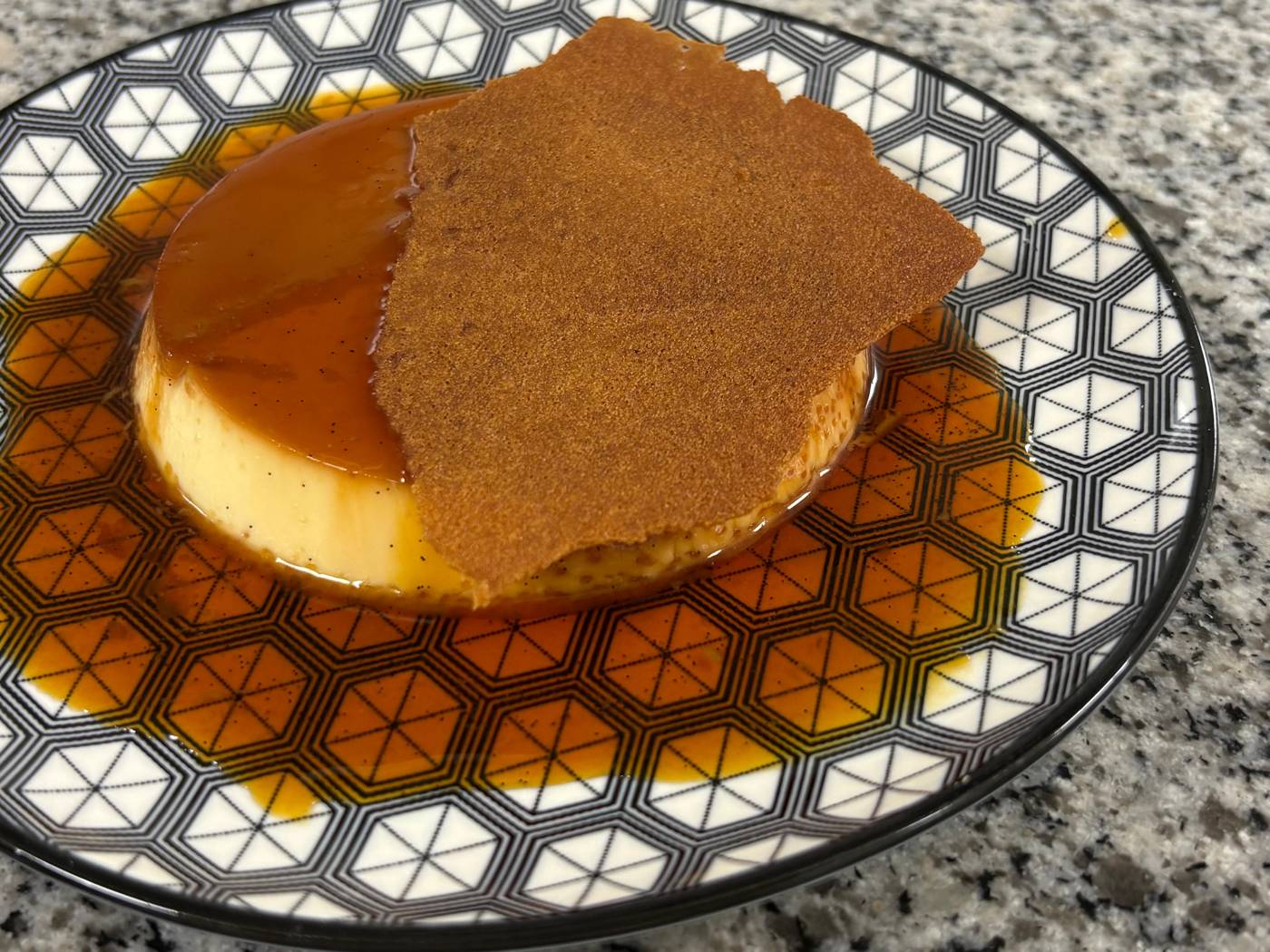 Caramel flan on a patterned plate